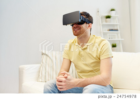 young man in virtual reality headset or 3d glasses 24754978