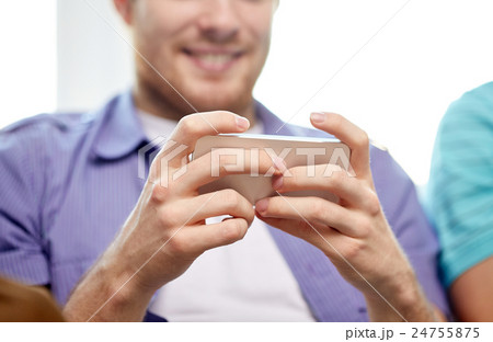 close up of happy man with smartphone at home close up of happy man with smartphone at home 24755875