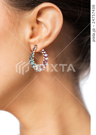close up of beautiful woman face with earring close up of beautiful woman face with earring 24757436