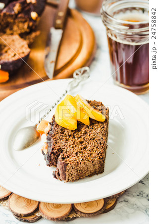 piece of chocolate cake with pumpkin, nuts,peaches 24758842