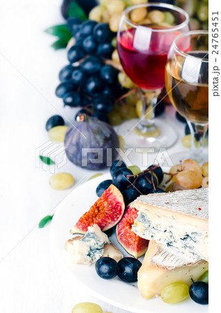 Wine, grape and cheese over white Wine, grape and cheese over white 24765451