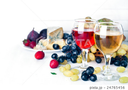 red and white wine in glasses on the table 24765456