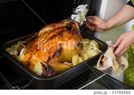 capon with baked potato cooked in domestic oven capon with baked potato cooked in domestic oven 24768968