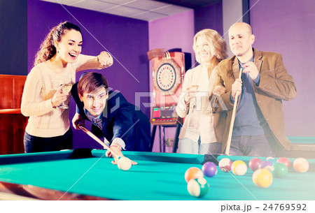 Group of adults playing pool. Group of adults playing pool. 24769592