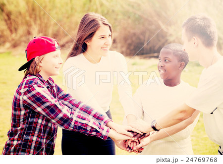 Four friends on countryside field Four friends on countryside field 24769768