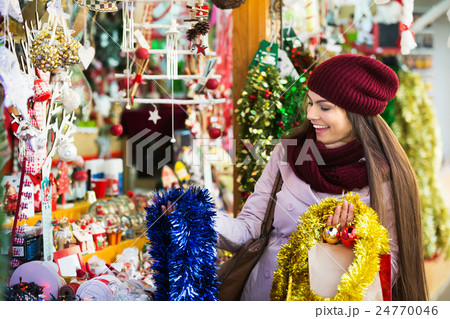 Girl shopping at festive fair Girl shopping at festive fair 24770046