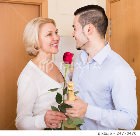 man and woman standing at doorway man and woman standing at doorway 24770470