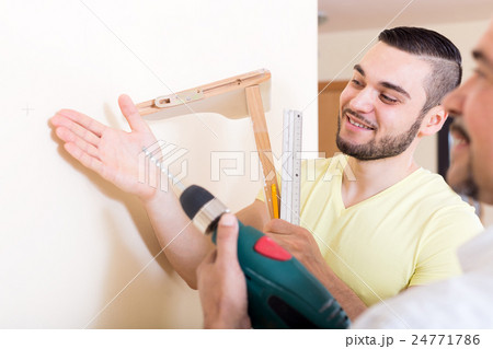 Two skilled men doing maintenance Two skilled men doing maintenance 24771786