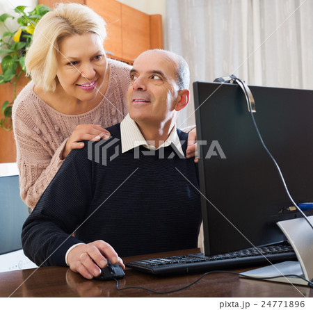 Senior couple talking with someone Senior couple talking with someone 24771896