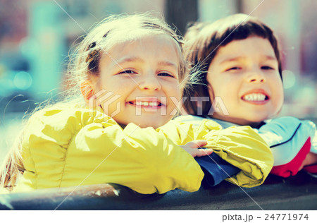 Preschool aged girls posing in urban street 24771974