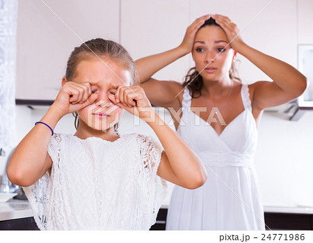 Upset girl and mother arguing Upset girl and mother arguing 24771986