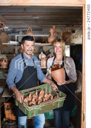 two artisans having ceramics two artisans having ceramics 24772400