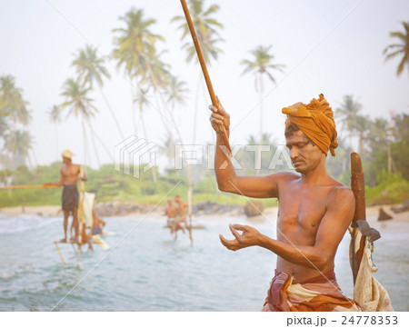 Stilt fishermen in Sri Lanka Concept Stilt fishermen in Sri Lanka Concept 24778353