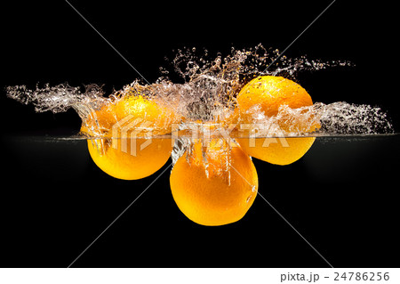 Group of fresh fruits falling in water on black Group of fresh fruits falling in water on black 24786256
