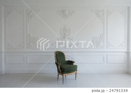 vintage luxury green armchair in white room over 24791339