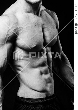 Muscular sexy torso of young sporty man with 24791848