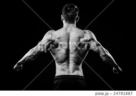 Young and fit bodybuilder athlete demonstrates Young and fit bodybuilder athlete demonstrates 24791887