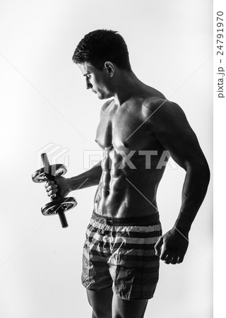 Young and fit male model posing his muscles Young and fit male model posing his muscles 24791970