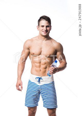 Fitness man holding a bottle of fresh water Fitness man holding a bottle of fresh water 24791988