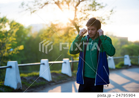 Toned Photo of Common young lonely man walking in Toned Photo of Common young lonely man walking in 24795904