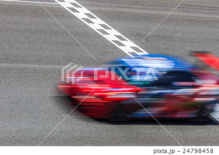 Race car racing on speed track with motion blur cr 24798458