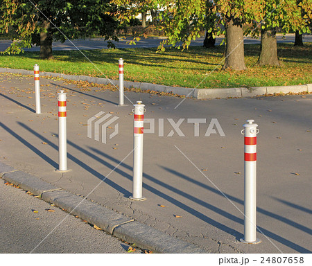 Restrictive fence on sidewalk 24807658