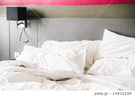 White pillow on bed 24810189