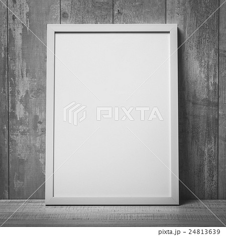 Blank white picture frame on the wall and the Blank white picture frame on the wall and the 24813639
