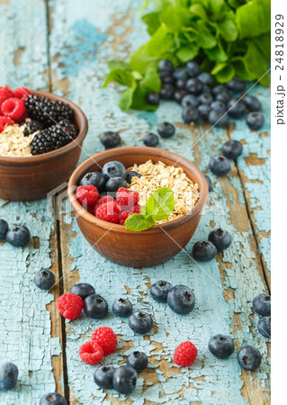 Healthy Homemade Oatmeal with Berries for Breakfast 24818929