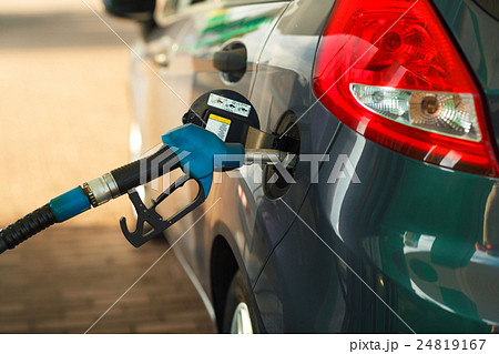 Car refueling on a petrol station Car refueling on a petrol station 24819167