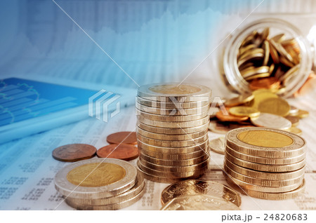 Business concept, coin stacks and tablet on news. 24820683