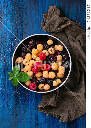 Heap of colorful raspberries 24821217