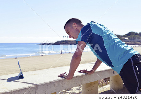 young sportsman doing incline push-ups young sportsman doing incline push-ups 24821420