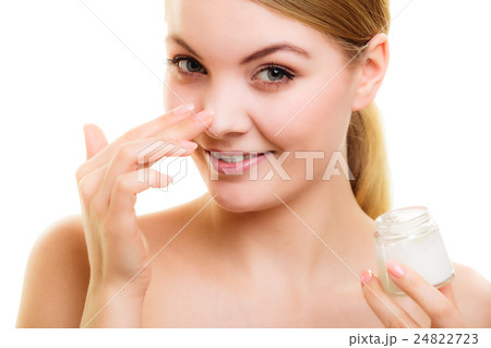 Skin care. Girl applying moisturizing cream. 24822723