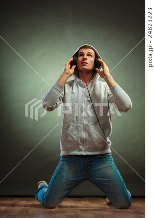 handsome man with headphones listening to music 24823223
