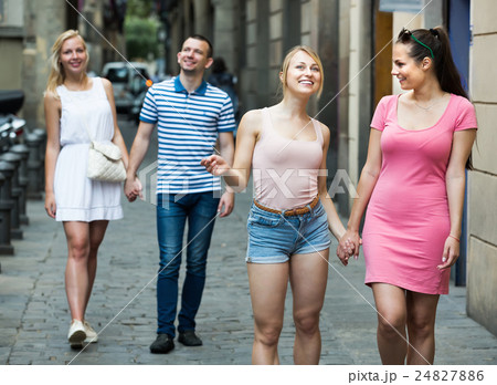 Portrait of two female friends taking walk in town 24827886