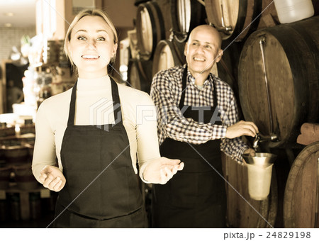 man and woman holding wine vessels man and woman holding wine vessels 24829198