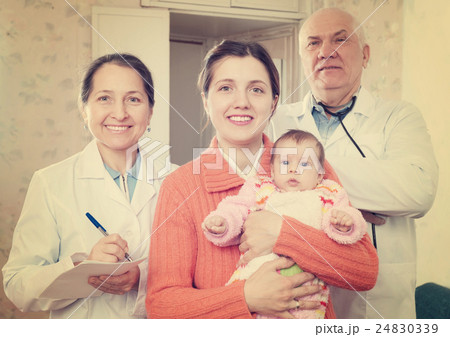 doctors and mother with three months baby 24830339