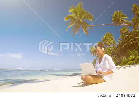Young Woman On Her Latop By The Beach Young Woman On Her Latop By The Beach 24834972
