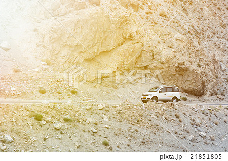 SUV driving on the rock mountain road in Leh,India SUV driving on the rock mountain road in Leh,India 24851805