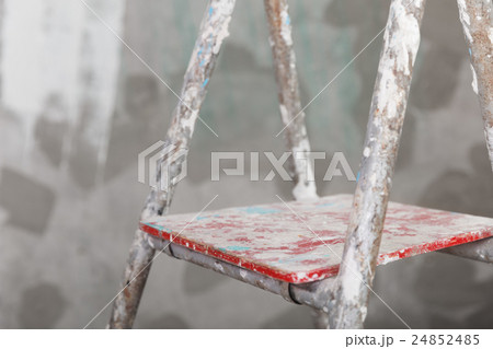 Old painted and stucco ladder on concrete wall 24852485