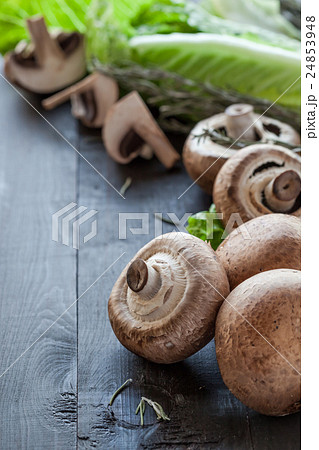 Fresh portobello on wooden background Fresh portobello on wooden background 24853948