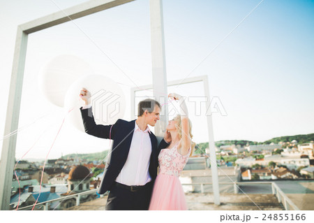Loving couple on the background of the setting sun Loving couple on the background of the setting sun 24855166