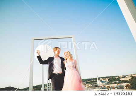 Loving couple on the background of the setting sun Loving couple on the background of the setting sun 24855168