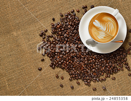 Top view, Cup of coffee latte and coffee beans Top view, Cup of coffee latte and coffee beans 24855358