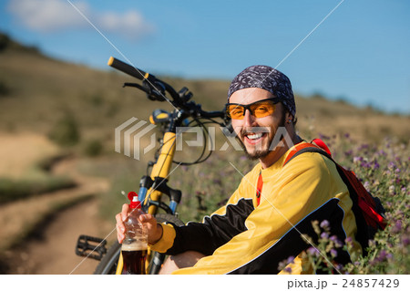young bright man on mountain bike young bright man on mountain bike 24857429