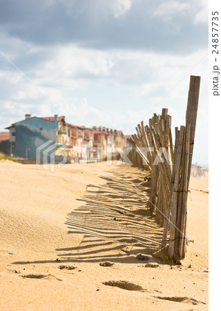 Wooden fence on Atlantic beach in France 24857735