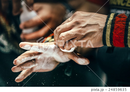 closeup of male hands with sports wristbands 24859635