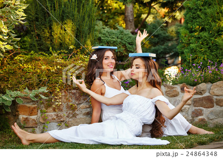 Sisters fooled with books 24864348