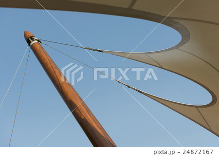 Organic shaped tent canvas to a wooden post. 24872167